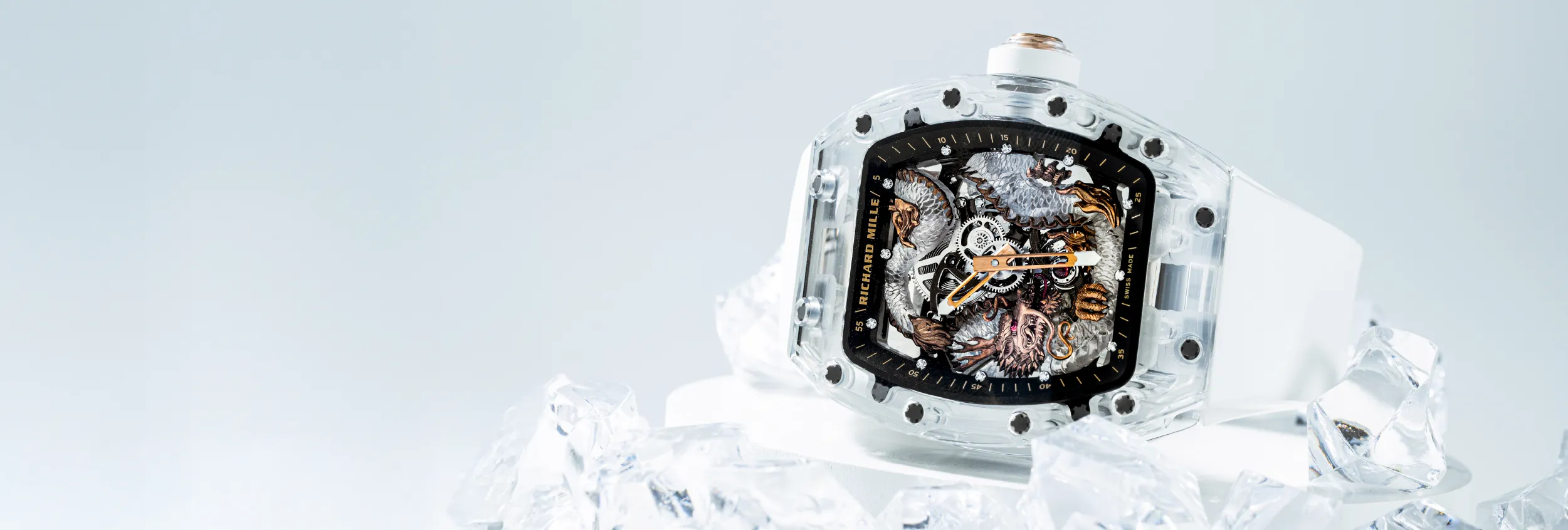 A selection of Richard Mille watches displayed with bold, avant-garde designs, emphasizing expertise from entry-level models to high-complication tourbillons.